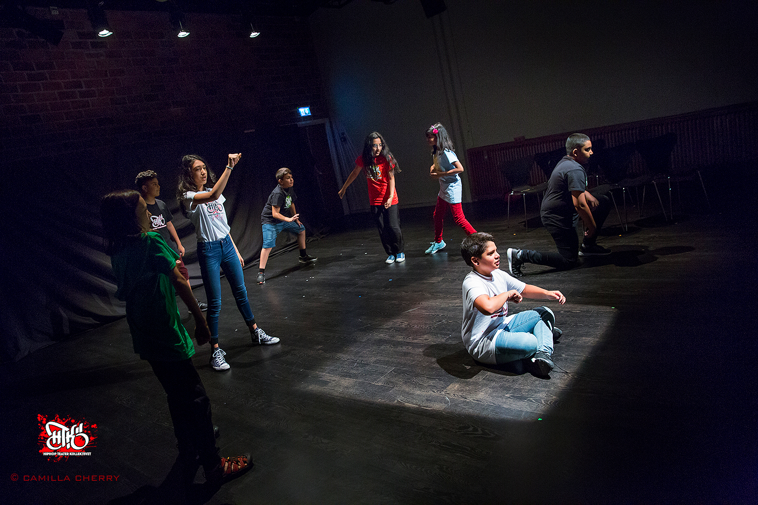 Young workshop participants in a theatre exercise, exploring conflict resolution through Forum Theatre